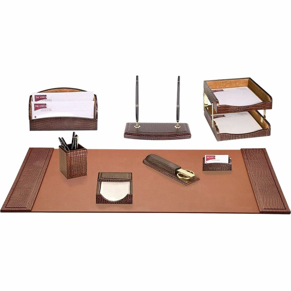 DACD2020 - 10-Piece Desk Set features a crocodile embossed design to add a smart, sophisticated look to your desk. Leather adds professional style to any work space. Soft velveteen protects surfaces from scuffs and scratches. Desk set includes a desk pad, two letter-size trays, pencil cup, memo holder, letter holder, business card holder, library set, double pen stand and stacking tray posts.