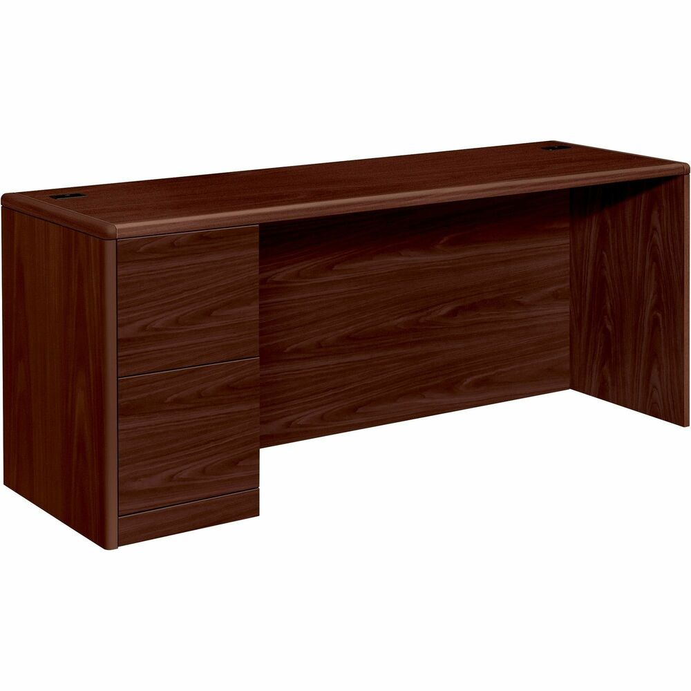 HON10708LNN - Left-pedestal credenza is part of HON 10700 Series Wood Laminate Furniture with an upscale design, stylish accent details, durable laminate surfaces and quality construction. Premium, multilayer, high-pressure, Mahogany laminate surface resists water, scratches and most solvents. Durable, 1-1/8" thick, solid-core, high-performance particleboard withstands frequent moving and handling. Design also features a full-height modesty panel, user-friendly waterfall edges and rounded corners. Credenza offers a core-removable lock and two file drawers for letter-size or legal-size filing. Mechanical interlock inhibits the extension of more than one drawer at a time. Five-sided construction allows easy drawer alignment. Cord management includes two grommets in the desktop and one-cord, pass-through grommet in top center of modesty panel for routing and hiding wires and cables.