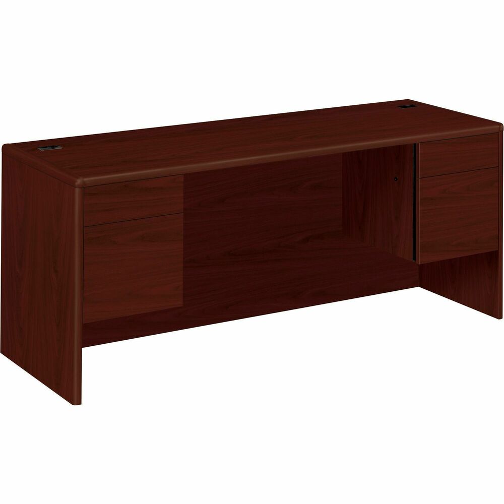 HON10743NN - Credenza with kneespace is part of HON 10700 Series Laminate Wood Desks with worksurfaces and outer end panels clad in multilayer, high-pressure laminate that resists water, abrasions and most solvents. Rich, Mahogany finish covers a durable, 1-1/8" thick, solid-core, high-performance particleboard that resists warping. Hardwood trim is stained to match the top-grade, stain-resistant laminate. Two 3/4 pedestals maximize filing storage space with a box/file design. All drawers lock. Five-sided drawer construction allows easy drawer alignment. Hangrails in file drawers offer side-to-side letter and legal filing and front-to-back letter filing. 72" wide credenza also features double-radius edge detail, 3-1/2" recessed modesty panel with one passthrough grommet in the top center, two worksurface grommets to route and hide cords, and adjustable hex leveling glides. Credenza is not designed for use with 24" deep modular or mobile pedestals.