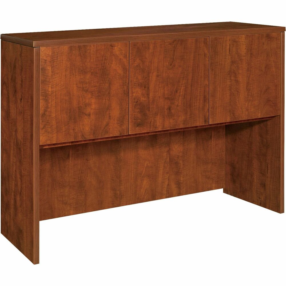 LLR69913 - Hutch with three doors is part of Lorell Essentials Series Laminate Furniture with high-quality laminate construction and metal-to-metal, cam-lock connections. Hutch easily attaches onto 60" wide credenzas and desk shells in this collection. Design includes one grommet for easy cord management, backing, Cherry laminate surfaces for durability and 3mm PVC edges.