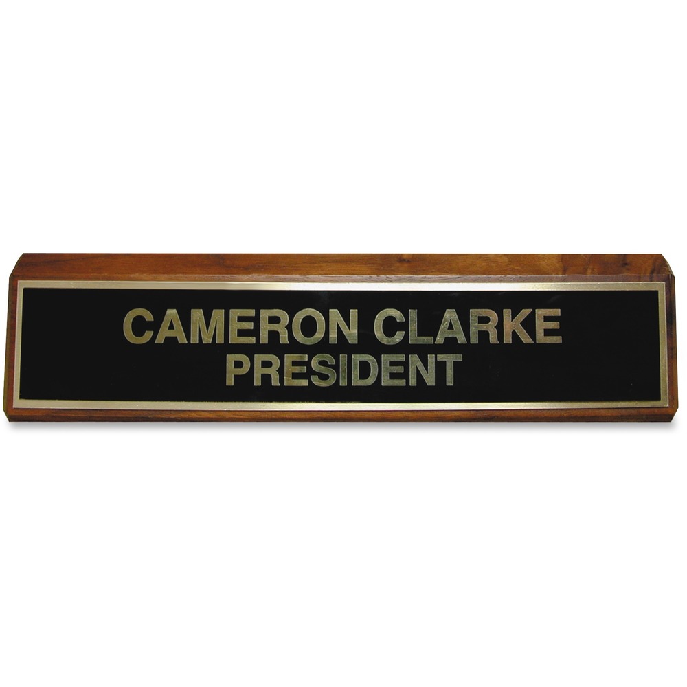XSTK89 - Display your name in style. Elegant brass plate on the quality walnut wood block is eye-catching and perfect for short messages or for department and personnel names. Brass plate engraving of your message or name shines against the black background. Sign dimensions are 2" x 10". Desk sign is recommended for offices, courthouses, schools and warehouses.