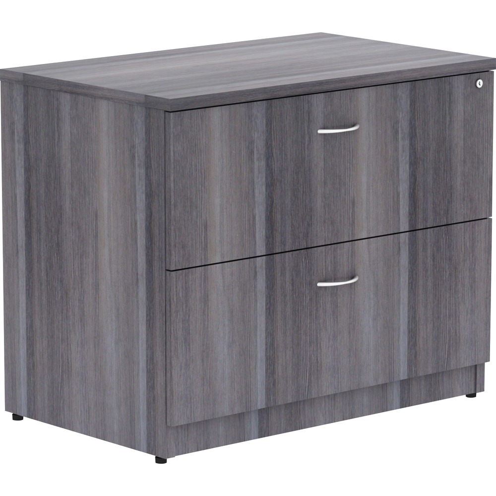 LLR69563 - Lateral file is part of Lorell Essentials Series Laminate Furniture with high-quality laminate construction and a contemporary design. Weathered Charcoal laminate top is 1" thick for durability. File drawer accommodates letter-size and legal-size files with included hangrails. Both drawers roll smoothly on steel ball-bearings with full extension. Central locking system locks both drawers at once. Anti-tip feature allows only one drawer to be opened at a time. Design also includes 3mm PVC edges and adjustable levelers for stabilization.
