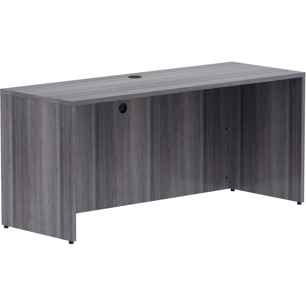 LLR69596 - Credenza shell is part of Lorell Essentials Series Laminate Furniture with high-quality laminate construction and metal-to-metal, cam-lock connections. Weathered Charcoal laminate top is 1" thick for durability. Use the two grommet holes in the top for easy cord routing. Design also includes 96mm metal drawer pulls with a silver brush finish, 3mm PVC edges and adjustable feet.