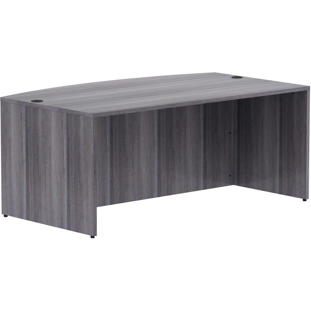 LLR69591 - Bowfront desk shell is part of Lorell Essentials Series Laminate Furniture with high-quality laminate construction and metal-to-metal, cam-lock connections. Weathered Charcoal laminate top is 1" thick for durability. Use the two grommet holes in the top for easy cord routing. Design also includes a full modesty panel for privacy, 3mm PVC edges and adjustable feet.