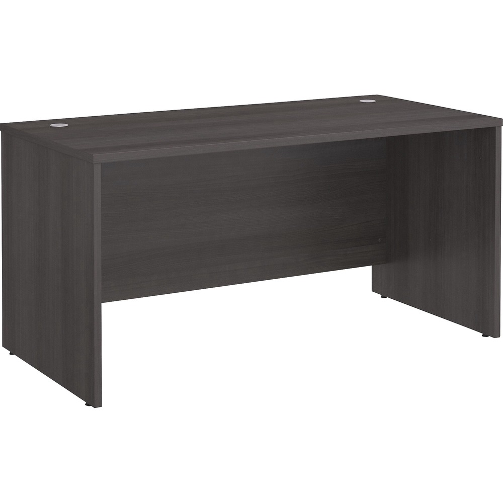 BSHSCD260SG - Studio C 60W Office Desk for a durable design works hard for years with a fresh finish that looks great anywhere. With a thick surface, extended modesty panel and clean lines, this desk conveys a classic look but adds a contemporary, Storm Gray finish to meet the style needs of the modern work space. Thermally fused laminate finish, durable edgebanding and sturdy end panels resist scratches, stains or dents while standing up to the rigors of a 40-plus hour work week. Keep pesky computer cords out of your way with the cable-management system (two grommets) for an organized worksurface. Combine the desk with matching products and accessories from the Studio C collection to create a unique office for the way you work. Desk accepts mobile file cabinets, pencil drawer or keyboard tray.