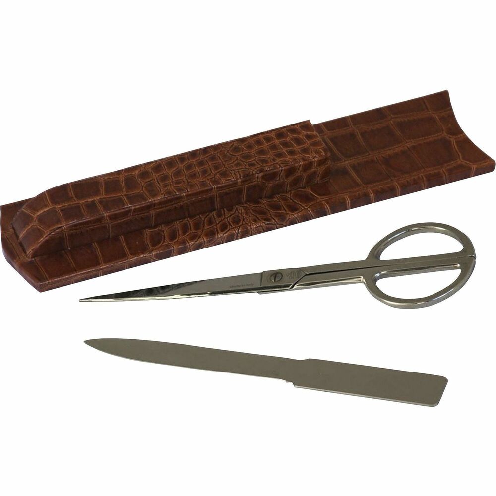 DACA6119 - Library Set features a stunning combination of Italian leather and handcrafted design to make it a showpiece that you'll be proud to feature prominently on your desk. Silver-accented scissors and letter opener are neatly stowed in a gorgeous leather holder unit that adds both function and beauty. Solid and hefty, the quality of the materials and construction are readily apparent. Unique, high-end style makes a statement of luxury in your office from day one. Leather adds a smart, sophisticated look to your space. Letter opener has a 5" blade. Scissors have 4" blades. Soft velveteen protects surfaces from scuffs and scratches.