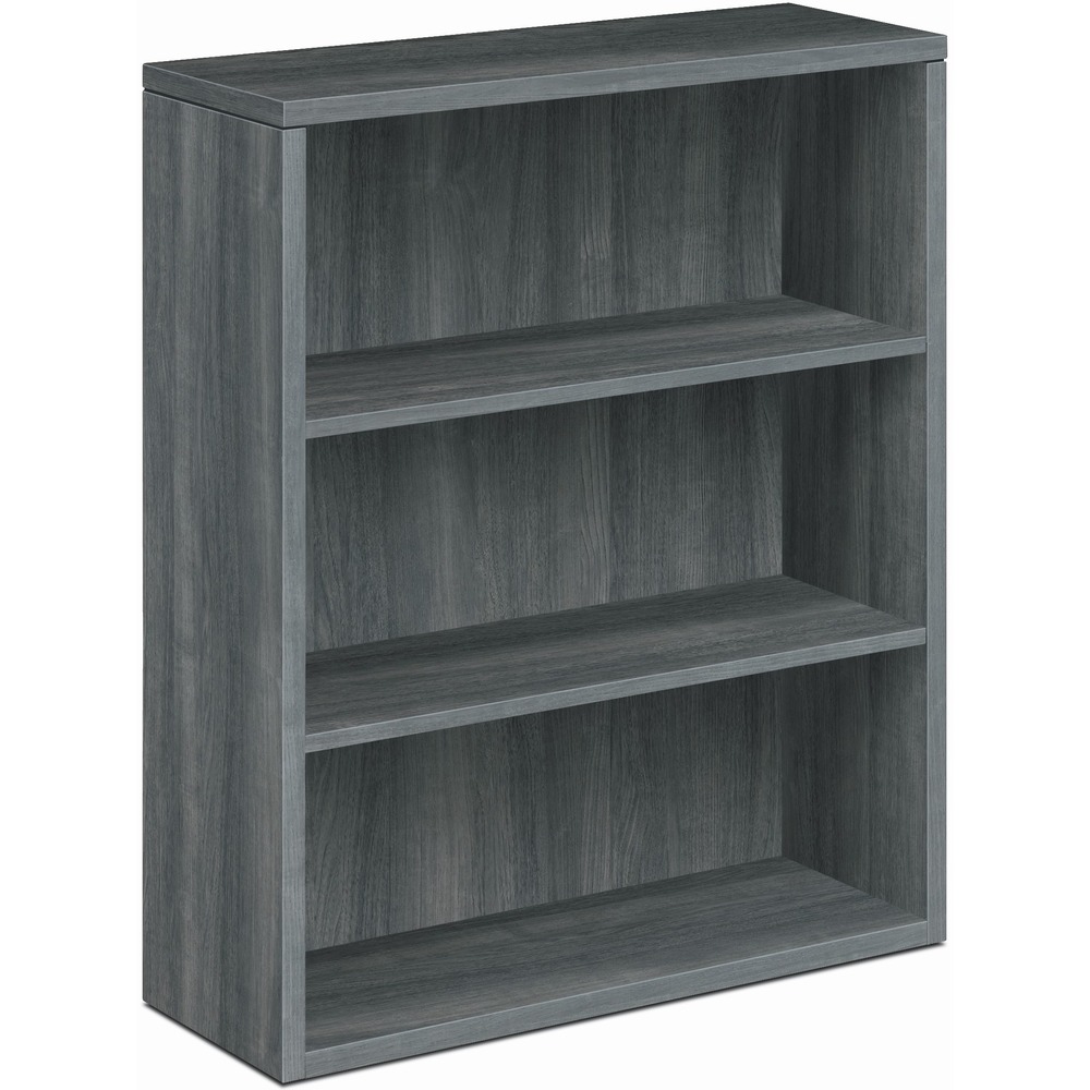 HON105533LS1 - Laminate bookcase is a part of HON 10500 Series Wood Laminate Furniture that complements many other furniture designs. The three shelves are fixed for dependable storage. Scratch-resistant, spill-resistant and wear-resistant, Sterling Ash laminate is applied to a strong inner-frame construction for trouble-free performance and long life. Bookcase also features a fully finished back, square corner edge detail and 3/4" thick interior shelves. The bottom shelf, top and end panels are 1-1/8" thick. Inside shelf dimensions are 33-5/8" wide x 11-5/8" deep x 12-1/2" high. Adjustable hex-leveling glides allow the freestanding bookcase to be easily leveled without lifting it. Glides offer a 3/4" adjustable range.