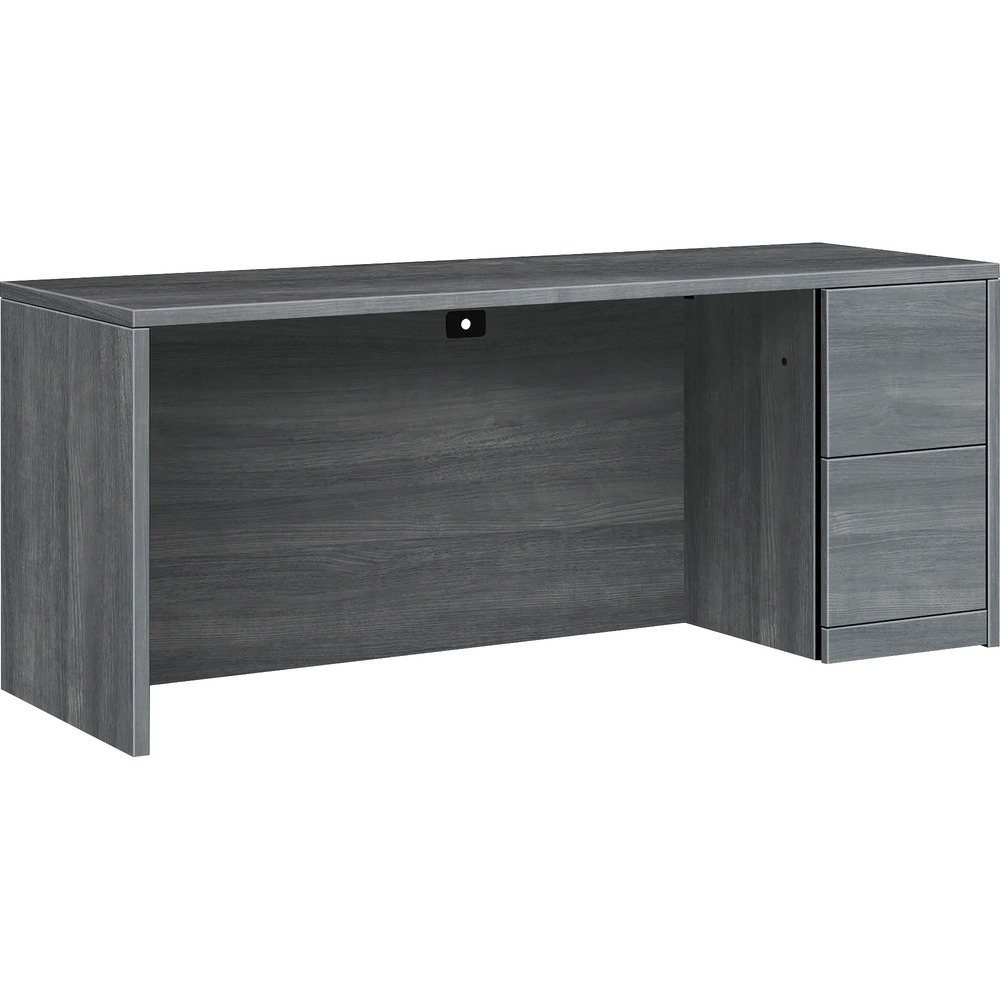 HON105903RLS1 - Single-pedestal credenza belongs to the HON 10500 Series Wood Laminate Furniture, a versatile collection for any office arrangement. Smooth, flat edges and a full modesty panel deliver a clean, streamlined look. Scratch-resistant, spill-resistant and wear-resistant laminate on strong inner-frame construction assures trouble-free performance and long life. Desk features one full pedestal on the right with two locking file drawers. File drawers include integrated hangrails for side-to-side letter-size and legal-size hanging folders and front-to-back letter-size filing. Both drawers have five-sided construction for added strength and easy alignment. Drawers operate on full-extension, ball-bearing suspension to ensure smooth, long-lasting operation. Credenza also has one-cord, passthrough grommet in the top center of the modesty panel to reach wall electrical outlets and interchangeable, core-removable lock for quick, easy rekeying. Center drawer for desk is sold separately.