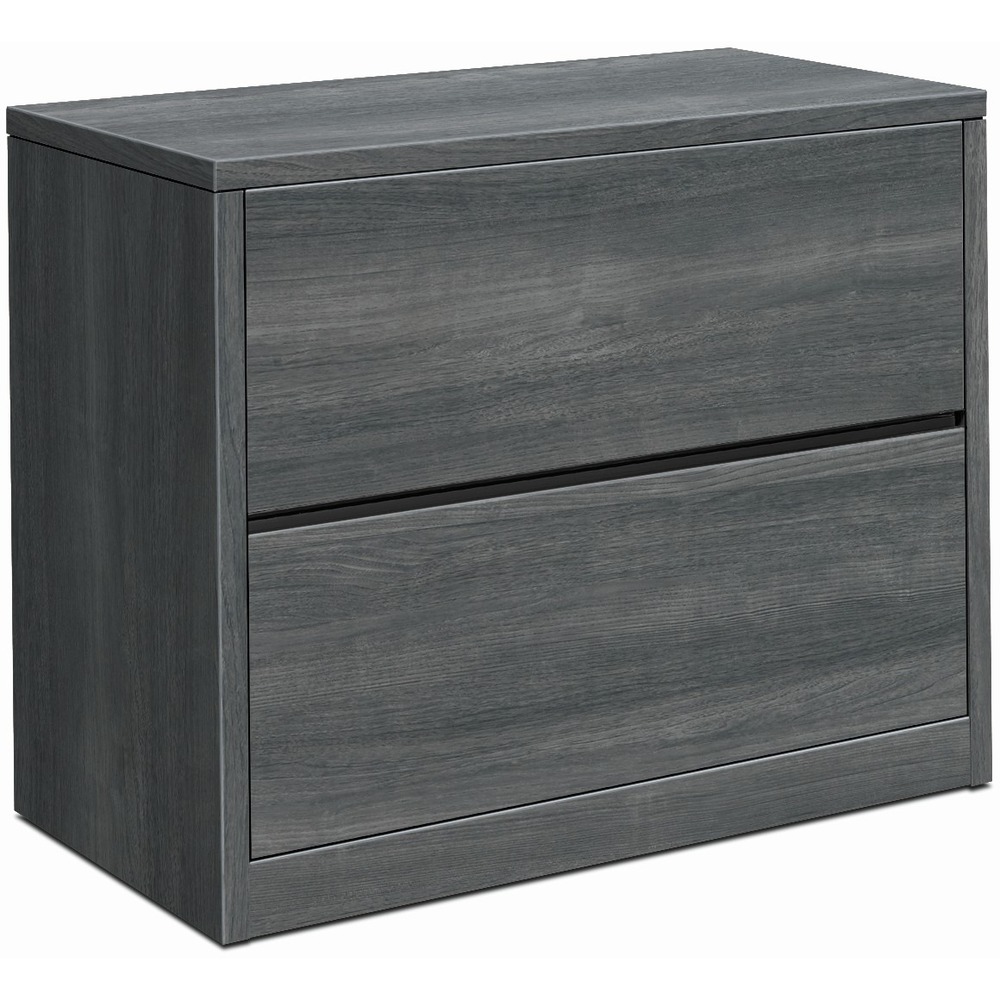 HON10563LS1 - Lateral file with two drawers is compatible with HON 10500 Series laminate wood furniture. Clean, straightforward design with square edges offers a streamlined look. Sterling Ash thermal-fused laminate is abrasion-resistant and stain-resistant. Durable, 1-1/8" thick, solid-core, high-density particleboard resists warping. Drawers operate on ball-bearing suspension with full extension. Hangrails are provided in all file drawers for side-to-side letter-size and legal-size filing and front-to-back letter-size filing. Mechanical interlock inhibits the extension of more than one drawer from opening at a time. Adjustable, hex leveling glides allow floorstanding furniture to be easily leveled without lifting the unit. Glides have 3/4" adjustable range. Lateral file is equipped with HON One Key interchangeable, core-removable lock to make rekeying quick and easy.