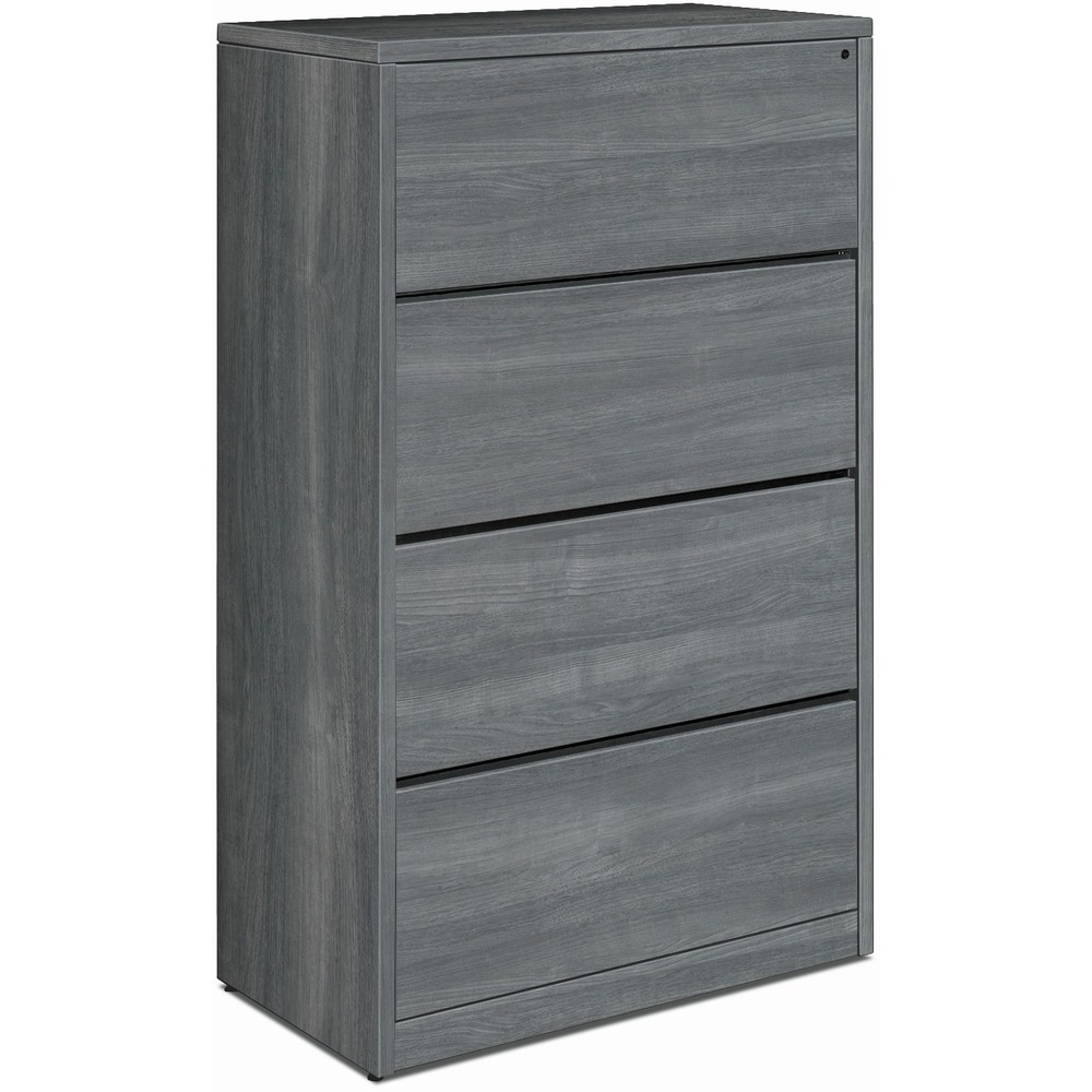 HON10516LS1 - Lateral file with four drawers is compatible with HON 10500 Series laminate wood furniture. Clean, straightforward design with square edges offers a streamlined look. Sterling Ash thermal-fused laminate is abrasion-resistant and stain-resistant. Durable, 1-1/8" thick, solid-core, high-density particleboard resists warping. Drawers operate on ball-bearing suspension with full extension. Hangrails are provided in all file drawers for side-to-side letter-size and legal-size filing and front-to-back letter-size filing. Mechanical interlock inhibits the extension of more than one drawer from opening at a time. Adjustable, hex-leveling glides allow floorstanding furniture to be easily leveled without lifting the unit. Glides have 3/4" adjustable range. Lateral file is equipped with HON One Key interchangeable, core-removable lock to make rekeying quick and easy.