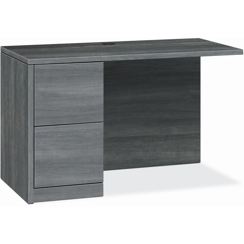 HON105908LLS1 - Return with single pedestal must be used with right-pedestal desks, desk shells, peninsulas or corner units in the HON 10500 Series Wood Laminate Furniture, a versatile collection for any office arrangement. Smooth, flat edges and a full modesty panel deliver a clean look. Scratch-resistant, spill-resistant and wear-resistant, Sterling Ash laminate on strong inner-frame construction assures trouble-free performance and long life. Return features one full pedestal on the left with two locking file drawers that include integrated hangrails for side-to-side letter-size and legal-size folders and front-to-back letter-size filing. Five-sided drawers operate on full-extension, ball-bearing suspension to ensure smooth, long-lasting operation. Non-freestanding return also has one worksurface grommet and one-cord, passthrough grommet in the top center of the modesty panel to reach wall electrical outlets and interchangeable, core-removable lock for quick, easy rekeying.