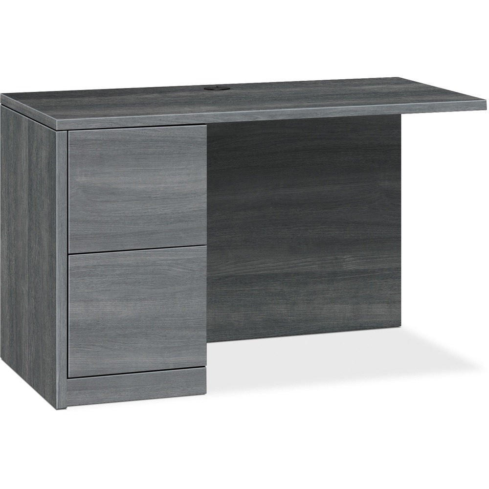 HON105906LLS1 - Return with single pedestal must be used with right-pedestal desks, desk shells, peninsulas or corner units in the HON 10500 Series Wood Laminate Furniture, a versatile collection for any office arrangement. Smooth, flat edges and a full modesty panel deliver a clean look. Scratch-resistant, spill-resistant and wear-resistant, Sterling Ash laminate on strong inner-frame construction assures trouble-free performance and long life. Return features one full pedestal on the left with two locking file drawers that include integrated hangrails for side-to-side letter-size and legal-size folders and front-to-back letter-size filing. Five-sided drawers operate on full-extension, ball-bearing suspension to ensure smooth, long-lasting operation. Non-freestanding return also has one worksurface grommet and one-cord, passthrough grommet in the top center of the modesty panel to reach wall electrical outlets and interchangeable, core-removable lock for quick, easy rekeying.
