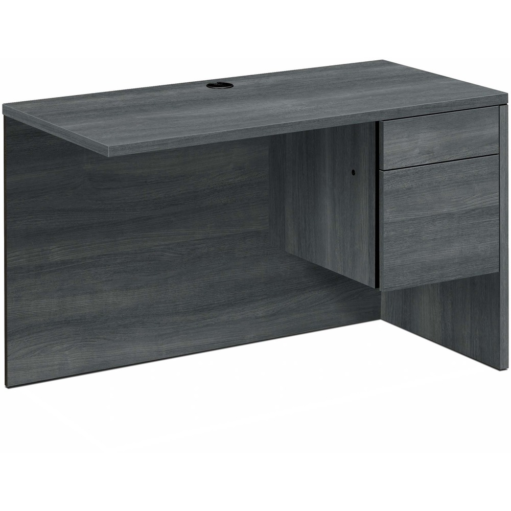 HON10515RLS1 - Right return with 3/4 pedestal is a part of HON 10500 Series Wood Laminate Furniture. To create an L-shaped layout, use with the 10500's left-pedestal desk. It can also be used with desk shells, peninsulas and corner units. Right return with formal, full-height modesty panel features one box and one file drawer. Locking drawers offer five-sided construction for easy drawer alignment. Interchangeable, core-removable lock makes rekeying quick and easy. Box drawer operates on ball-bearing suspension with 3/4 extension. File drawer extends fully on ball-bearing suspension. Included hangrails are designed for side-to-side letter-size or legal-size filing and front-to-back letter-size filing. Top and end panels are made with durable, thermal-fused laminate over durable, 1-1/8" thick, solid-core high-performance particleboard and resist warping, scratches and stains. One-cord, pass-through, 3" grommet in the top is designed to reach electrical wall outlets while routing wires and cables.