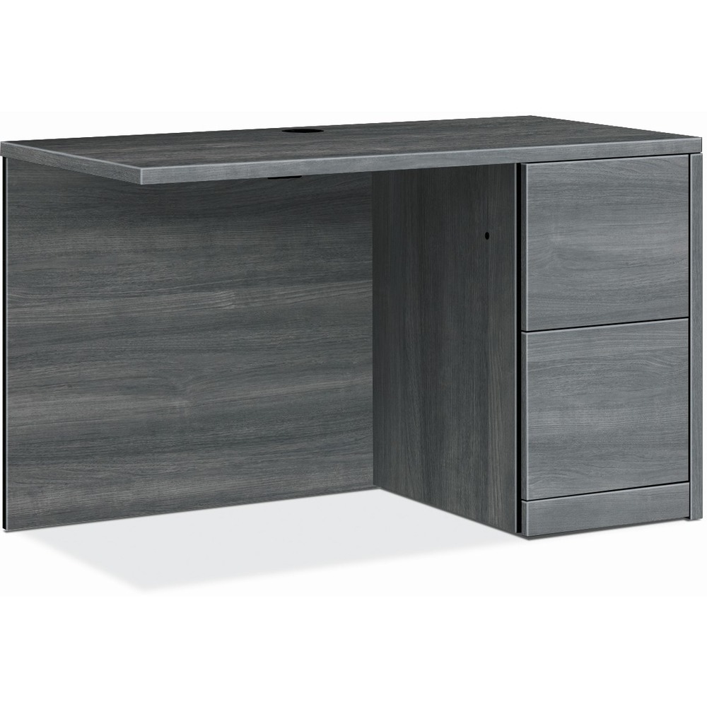 HON105907RLS1 - Return with single pedestal must be used with left-pedestal desks, desk shells, peninsulas or corner units in the HON 10500 Series Wood Laminate Furniture, a versatile collection for any office arrangement. Smooth, flat edges and a full modesty panel deliver a clean look. Scratch-resistant, spill-resistant and wear-resistant, Sterling Ash laminate on strong inner-frame construction assures trouble-free performance and long life. Return features one full pedestal on the right with two locking file drawers that include integrated hangrails for side-to-side letter-size and legal-size folders and front-to-back letter-size filing. Five-sided drawers operate on full-extension, ball-bearing suspension to ensure smooth, long-lasting operation. Non-freestanding return also has one worksurface grommet and one-cord, passthrough grommet in the top center of the modesty panel to reach wall electrical outlets and interchangeable, core-removable lock for quick, easy rekeying.