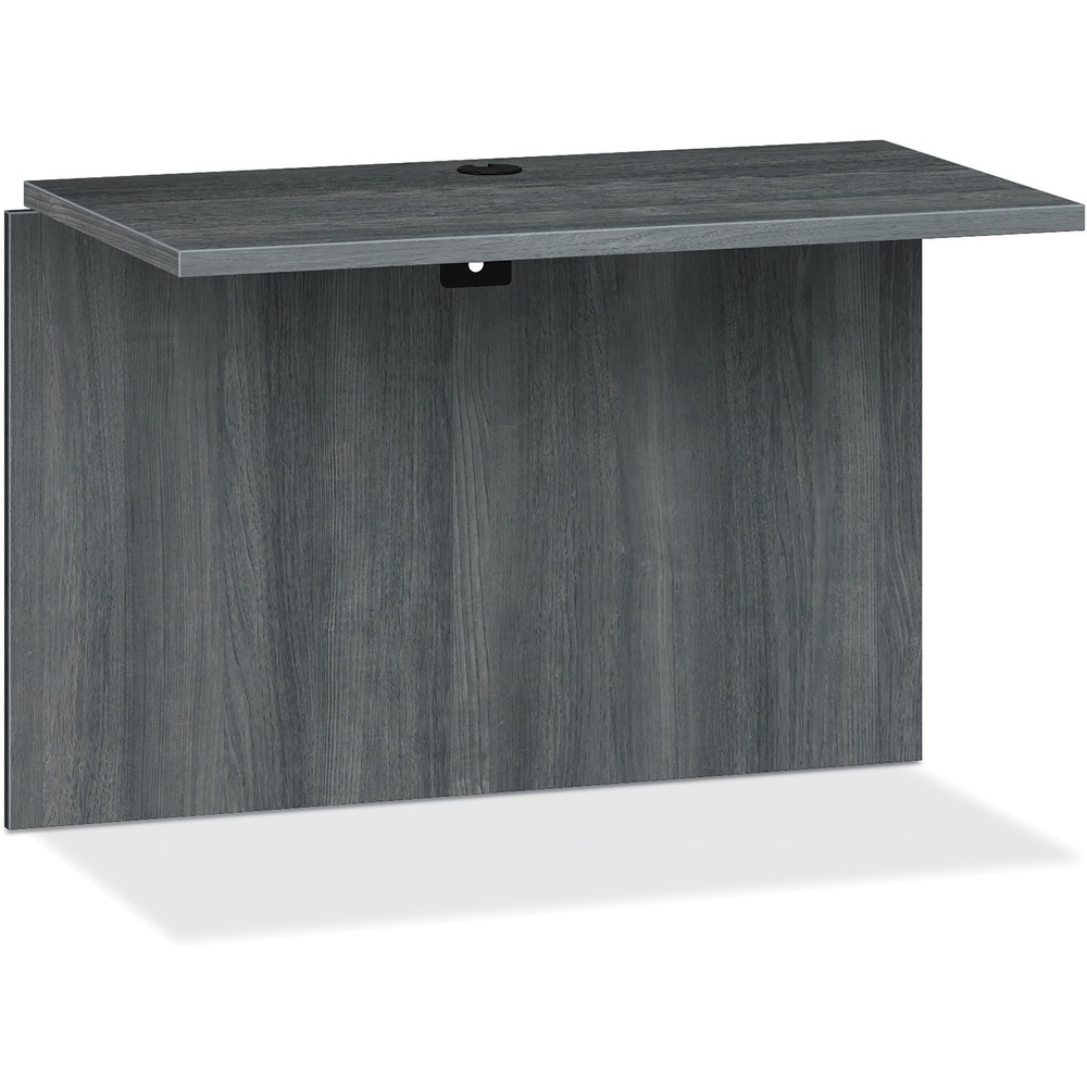 HON10560LS1 - Bridge is part of HON 10500 Series Wood Laminate Desking that offers practical functionality and uncompromising durability. Durable, 1-1/8" thick, solid-core, high-performance particleboard resists warping. Premium, multi-ply laminate stands up to scratches, spills, stains and boiling liquids, and holds up under heavy use. Bridge adds extra work space and connects various components of this series including a single-pedestal desk, desk shell or peninsula to a corner unit, single-pedestal credenza or credenza shell. Clear inside depth is 21-7/8". Formal, full-height modesty panel features one-cord, passthrough the grommet in the top center for easy access to wall electrical outlets.