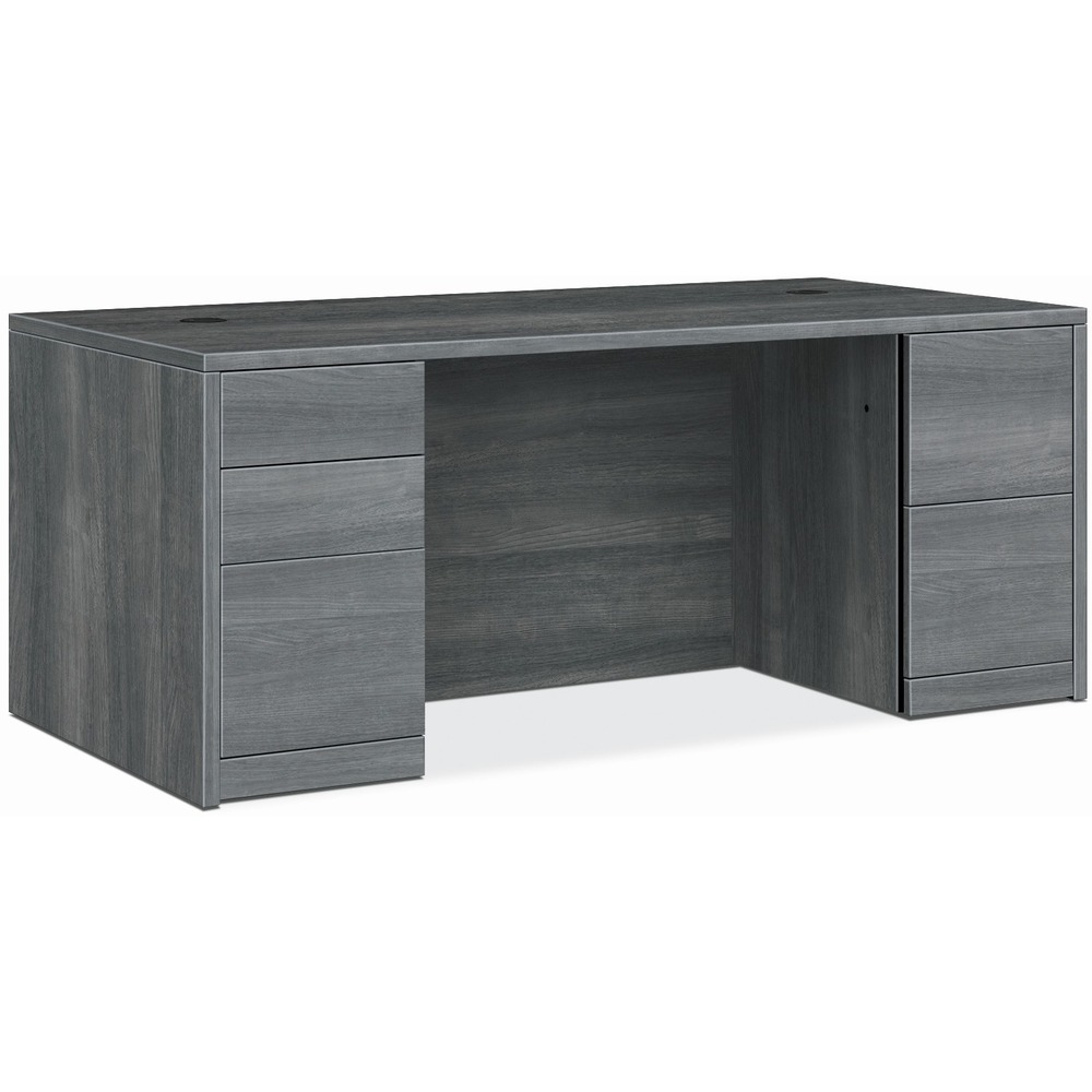 HON105890LS1 - Double-pedestal desk belongs to the HON 10500 Series Wood Laminate Furniture, a versatile collection for any office arrangement. Smooth, flat edges and a full modesty panel deliver a clean, streamlined look. Scratch-resistant, spill-resistant and wear-resistant, Sterling Ash laminate on strong inner-frame construction assures trouble-free performance and long life. Desk features two full pedestals with five-sided drawer construction for added strength and easy alignment. One pedestal includes two box drawers for supplies and one file drawer for filing. The other pedestal includes two file drawers. All file drawers include integrated hangrails for side-to-side letter-size and legal-size hanging folders and front-to-back letter-size filing. Drawers operate on full-extension, ball-bearing suspension. Desk also has interchangeable, core-removable lock for quick, easy rekeying and two 3" round grommets to route and hide wires and cables. Center drawer for the desk is sold separately.