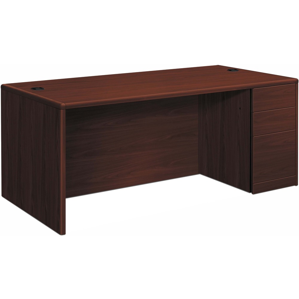 HON10701RNN - Right-pedestal desk is part of HON 10700 Series Laminate Wood Desks with worksurfaces and outer end panels clad in multilayer, high-pressure laminate that resists water, abrasions and most solvents. Rich Mahogany finish covers durable, 1-1/8" thick, solid-core, high-performance particleboard that resists warping. Elegant hardwood trim is stained to match the top-grade, stain-resistant laminate. User-friendly waterfall edges offer a gentle, curved profile. One full pedestal on the right maximizes versatile storage space with a box/box/file configuration. All drawers lock. Five-sided drawer construction allows easy drawer alignment. Hangrails in all file drawers offer side-to-side letter and legal filing and front-to-back letter filing. Double-pedestal desk also features double-radius edge detail; 4-1/2" recessed, woodgrain, breakfront modesty panel; and two worksurface grommets to route and hide cords. Adjustable hex leveling glides allow easy leveling without lifting.