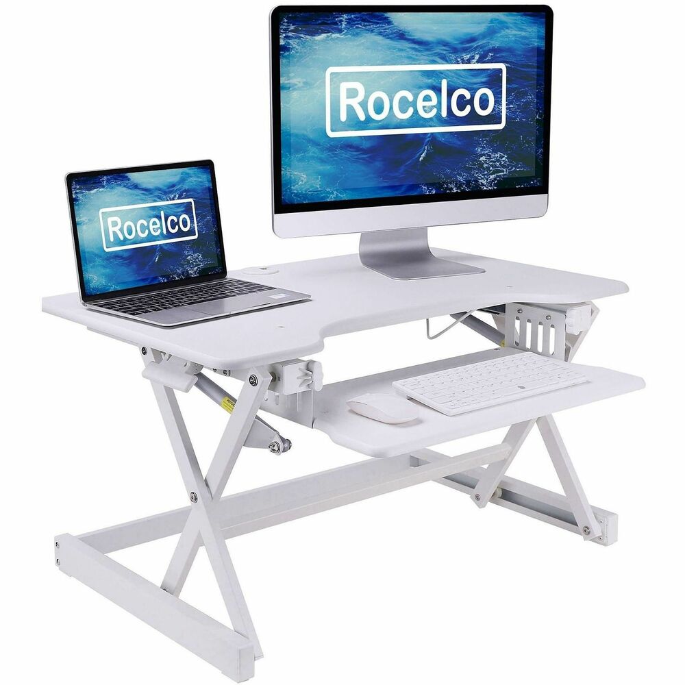 RCLREADRW - The Rocelco EADRW Height Adjustable Sit to Standing Desk Riser and Converter offers the versatility you need to get through your work day. Now you can sit part of the day or stand to take advantage of all the health benefits that come with standing and moving around. With the EADRW2, you and your associates will become healthier and more productive. It fits over your current desk with no need to buy additional furniture.  LARGE WORK SURFACE: 32" wide by 20.5" deep desktop that holds up to two 24" monitors or one 32" monitor and retractable keyboard tray is 21" wide by 11" deep RETRACTABLE ERGONOMIC KEYBOARD TRAY: 4.5" spacing between keyboard tray and desktop keeps monitor at proper ergonomic height to prevent neck strain while sitting or standing, keyboard tray extends for optimum comfort. Large 21" x 11" keyboard tray size will hold a laptop if needed. EASY HEIGHT ADJUSTMENT WITH EVR ENHANCED VERTICAL RANGE: Sturdy metal frame with easy-grip side handles and gas piston assist, can raise and lower up to 35 lbs., with continuous height adjustment from 5" up to 18" above desktop to optimize the ergonomic work position for people of all heights. Straight up and down motion minimizes required depth (21"). GROMMET HOLE: For hassle free cable management, or to install a monitor mount for 1 or 2 monitors, such as the Rocelco DM1 or DM2. NO ASSEMBLY REQUIRED: Simply remove from box and place directly on existing desktop. WARRANTY: Manufacturer Limited 1 YR Warranty HEALTH BENEFITS: Easy and affordable solution to start enjoying the health benefits of standing while you work Licensed under U.S. Patent Nos. 9,113,703; 9,277,809; 9,554,644; 9,924,793 and other pending/issued U.S. and foreign patents. 