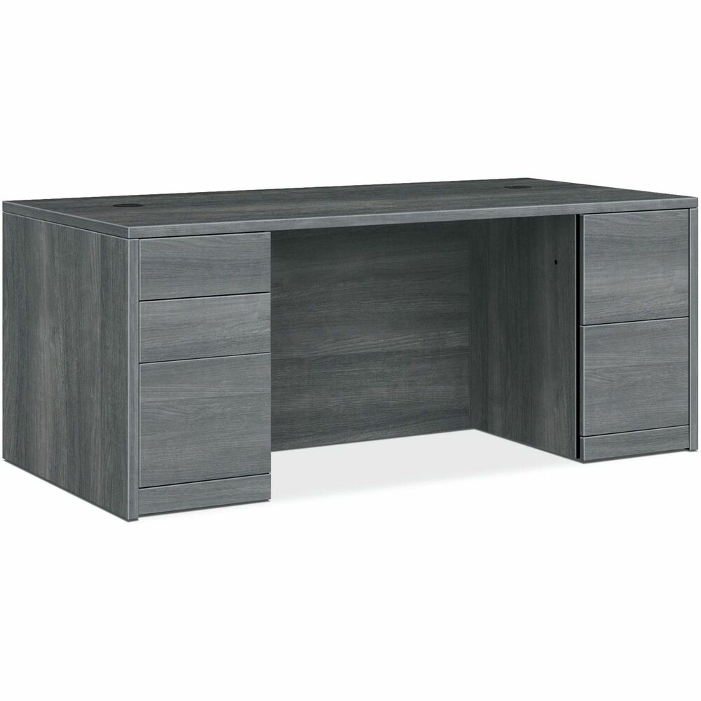 HON105891LSA1 - Double-pedestal desk belongs to the HON 10500 Series Wood Laminate Furniture, a versatile collection for any office arrangement. Smooth, flat edges and a full modesty panel deliver a clean, streamlined look. Scratch-resistant, spill-resistant and wear-resistant, Sterling Ash laminate on strong inner-frame construction assures trouble-free performance and long life. Desk features two full pedestals with five-sided drawer construction for added strength and easy alignment. One pedestal includes two box drawers for supplies and one file drawer for filing. The other pedestal includes two file drawers. All file drawers include integrated hangrails for side-to-side letter-size and legal-size hanging folders and front-to-back letter-size filing. Drawers operate on full-extension, ball-bearing suspension. Desk also has interchangeable, core-removable lock for quick, easy rekeying and two 3" round grommets to route and hide wires and cables. Center drawer for the desk is sold separately.