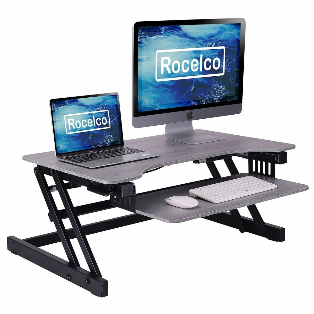 RCLRADRG - Standing desk converter provides a reliable and efficient work space with a sturdy steel frame, easy-grip side handles. Pneumatic gas dual piston assist allows smoother and more precise height adjustment. Benefits of alternating between sitting and standing while working include reduced back pain and strain and a boost in overall health and energy. Spacious and ergonomic top workstation measures 32" wide x 20.6" deep and encourages productivity by accommodating either two medium-size monitors with a laptop or one large monitor with a laptop. Desk converter supports up to 30 lb. and adjusts to heights ranging from 4.75" to 16.75" to let people of most heights to work from an ergonomic position. Large, retractable keyboard tray measures 23.6" wide x 11.6" deep and can hold anything from a keyboard to a laptop. Anti-scratch pads made from rubber and foam allow top desk riser to be placed directly on your current worksurface and to remain stationary.