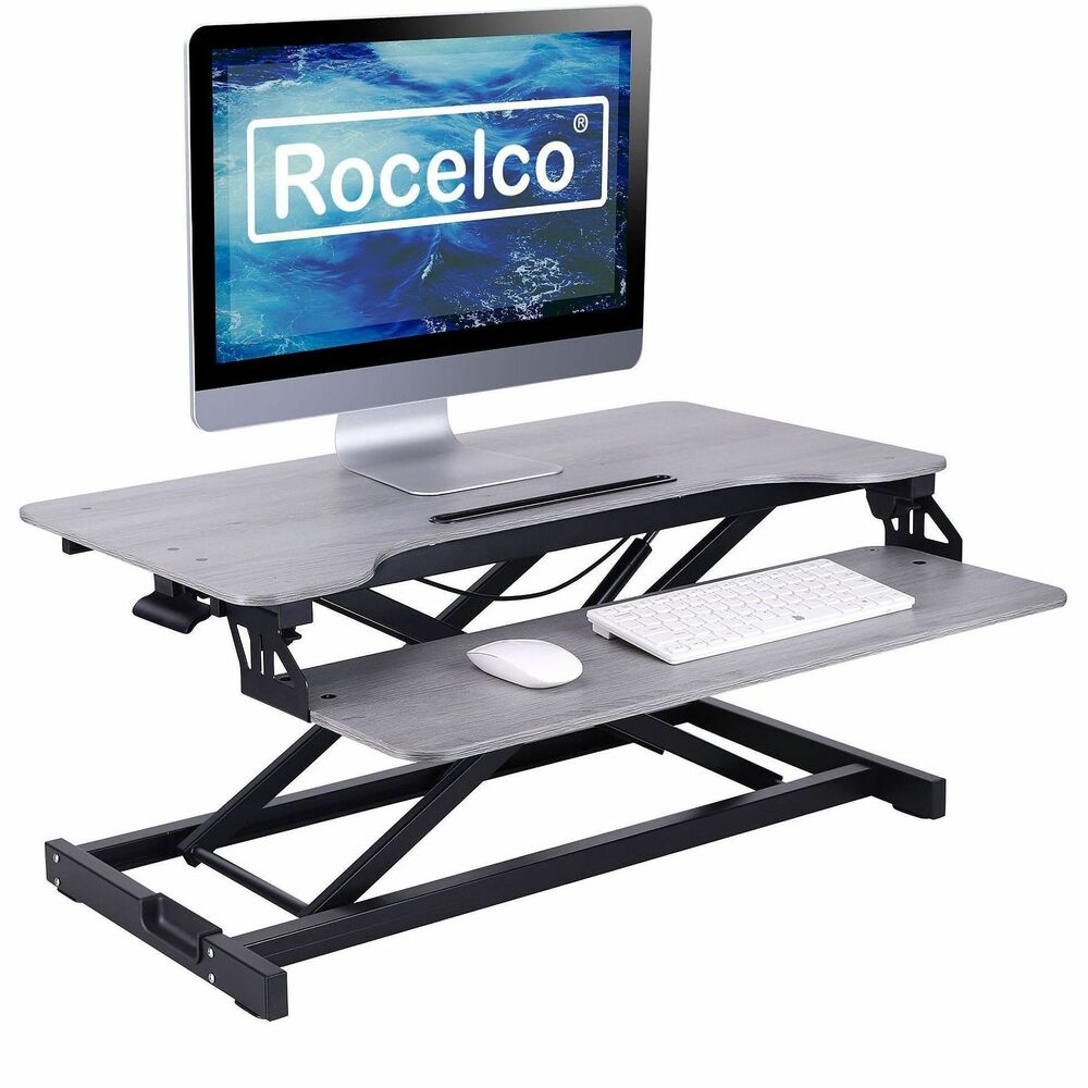 RCLRVADRG - Desk Riser and Converter's spacious work space measures 31.5" wide x 17.25" deep and lets you work from either a standing or seated position. Benefits of alternating between sitting and standing while working include reduced back pain and strain and a boost in overall health and energy. Riser's height adjusts to heights ranging from 4.3" to 19.17" and requires only 17" of depth, creating an ergonomic work space for people of most heights. A gas piston assist easily lifts and lowers computer monitors, laptops and more up to 30 lb. Additional features include a large, detached keyboard tray measuring 29" wide x 10" deep, a 10.5" slot for tablets and mobile phones and a sleek gray woodgrain finish. Convenient grommet hole manages untidy cables and wires.