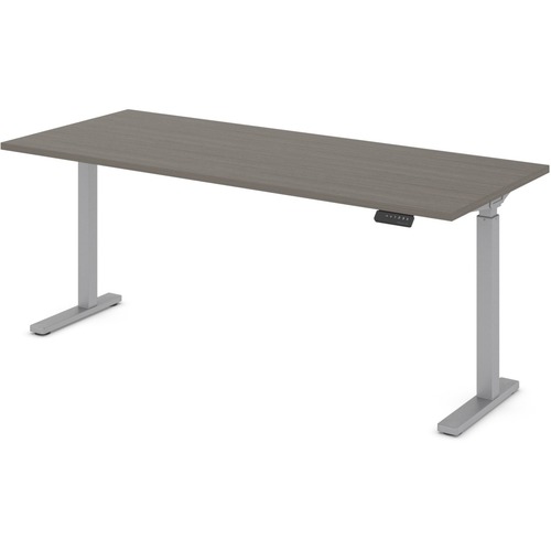 Offices To Go Ionic | 70"W x 29"D Electric Height Adjustable Rectangular Table - 1" Top, 70" x 29" x 45.5" , 0.1" Edge - Material: Thermofused Laminate (TFL) Top - Finish: Absolute Acajou, Silver Base