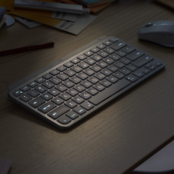 Introducing MX Keys Mini, a smaller, smarter, and mightier minimalist keyboard made for creators in Pale Grey