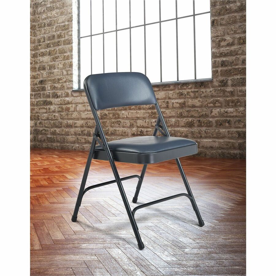 National Public Seating 1200 Series Upholstered Folding Chair - Dark Midnight Blue Seat Color - Vinyl, Foam Seat Material - Dark Midnight Blue Back Color - Vinyl Back Material - Char Blue Frame Color - Tubular Steel Frame Material - Dark Midnight Blue - V