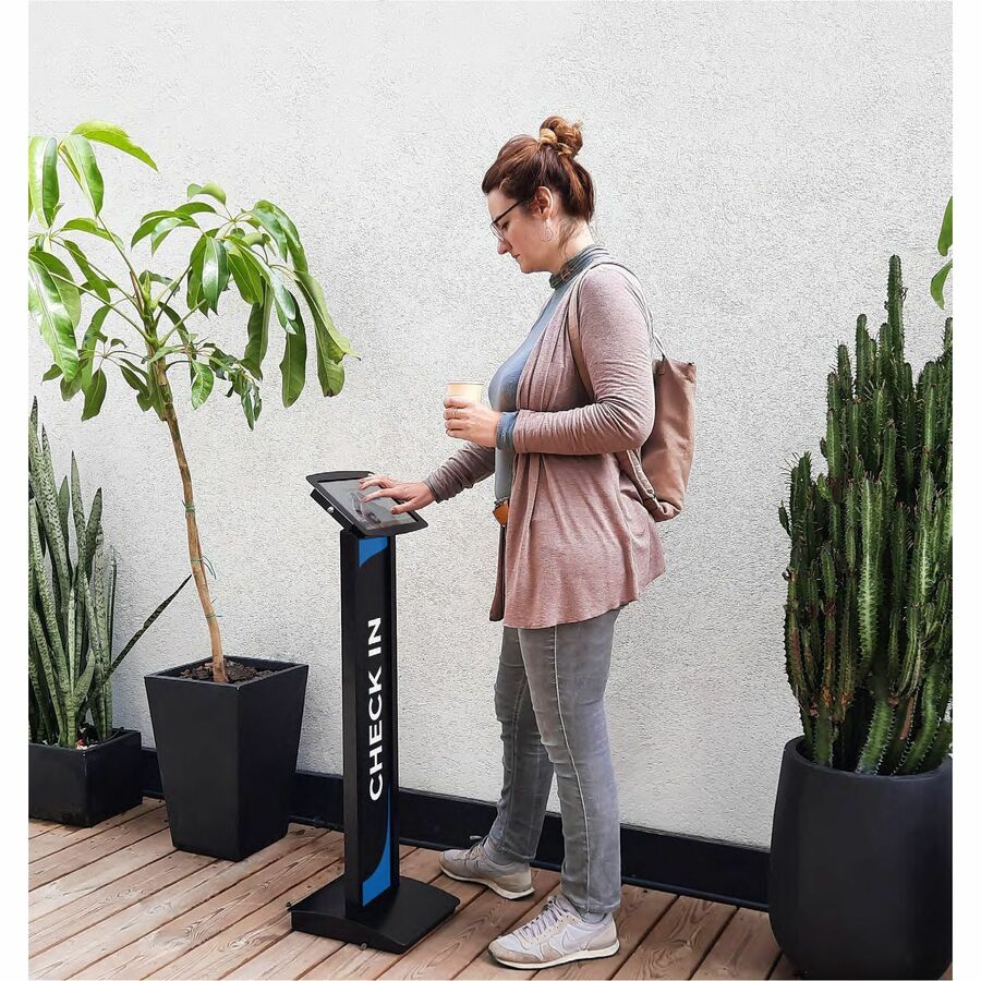 Compulocks black Space Enclosure floor stand holding a Galaxy Tab A8 10.5 in with brandable front panel — life-style view