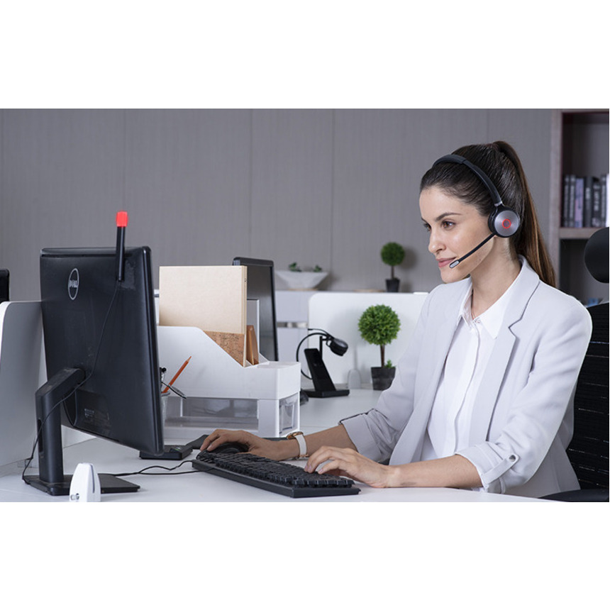 Yealink WH62 Mono UC V3 wireless mono headset with base, busy light, and MicroUSB connections — life-style view