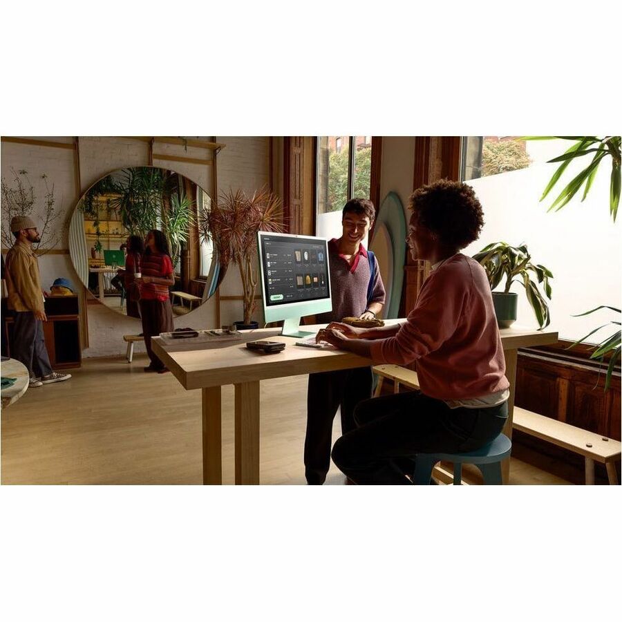 Green Apple iMac 24-inch all-in-one desktop with 4.5K Retina display — life-style view