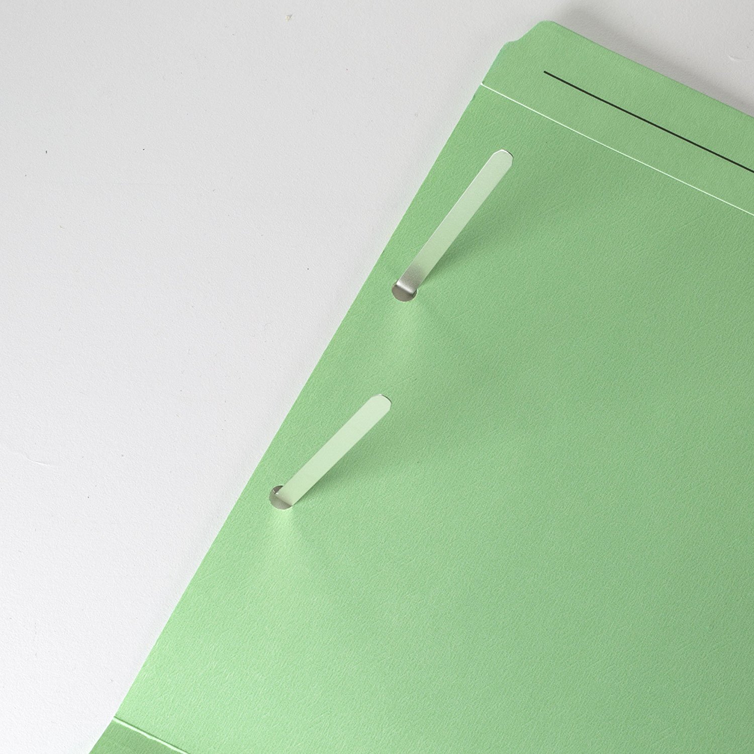 Locking compressors slide over base prongs to keep papers tightly compressed to save valuable filing and storage space