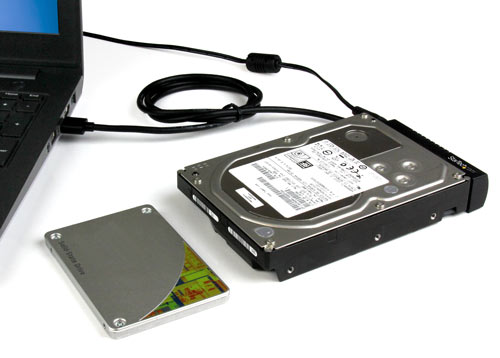 An external solid-state drive connected to a laptop through the USB 3.1 to SATA adapter 