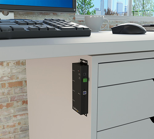 Sch&egrave;ma d'un hub fix&egrave; &agrave; une surface sous un bureau 